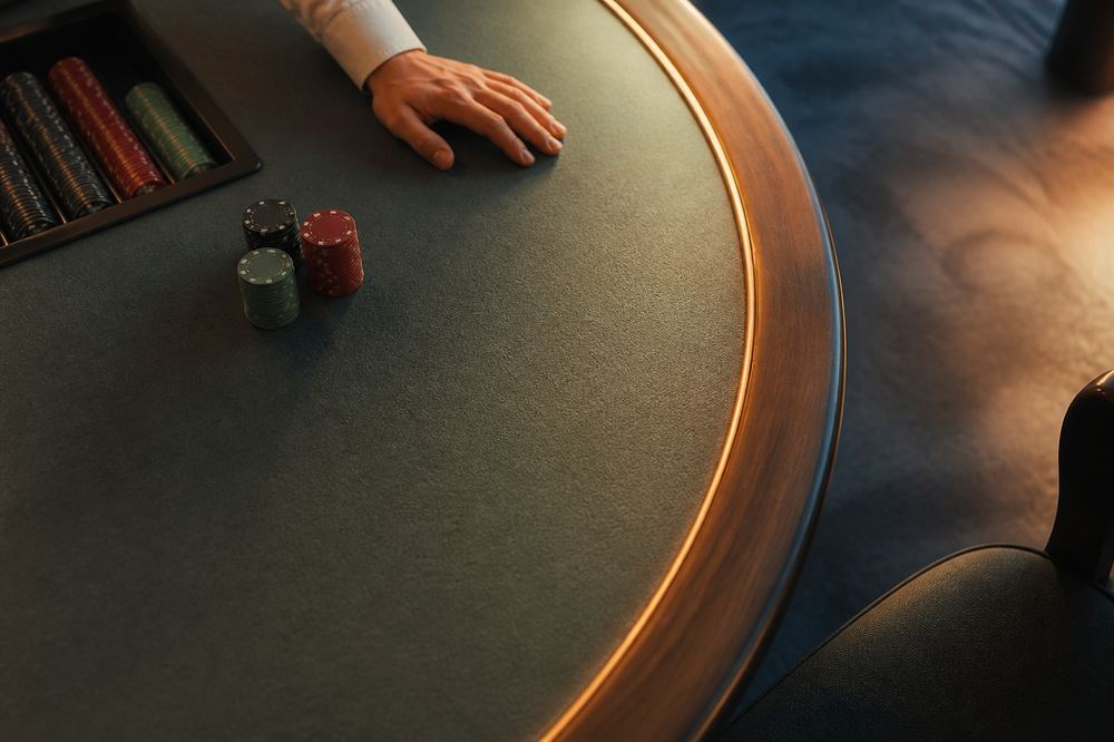 Quiet view of a felt table edge and chips